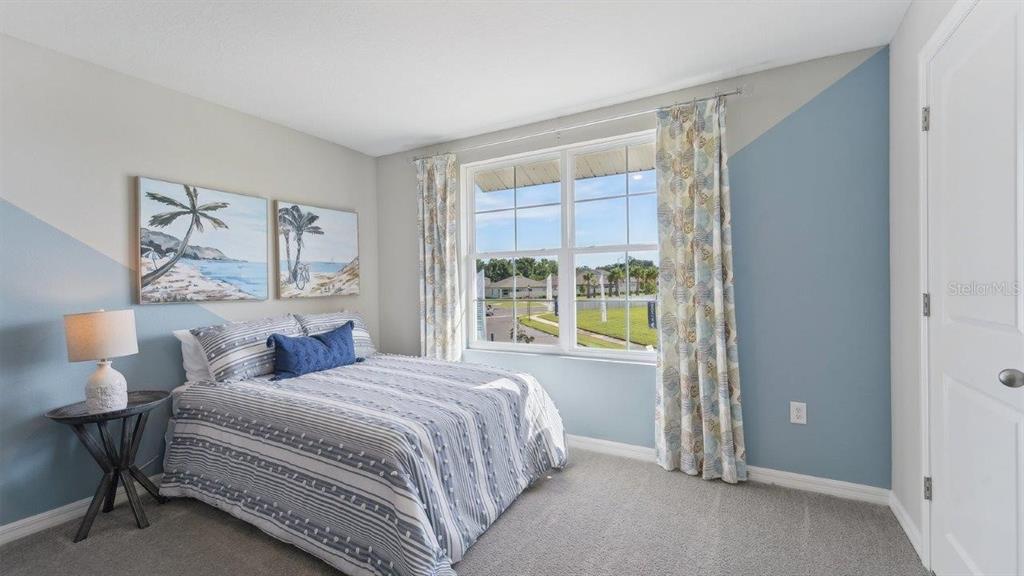 17563 Acorn Drop Road Land O Lakes, FL 34638 - Photo 9 of 23 a bedroom with a bed and a window