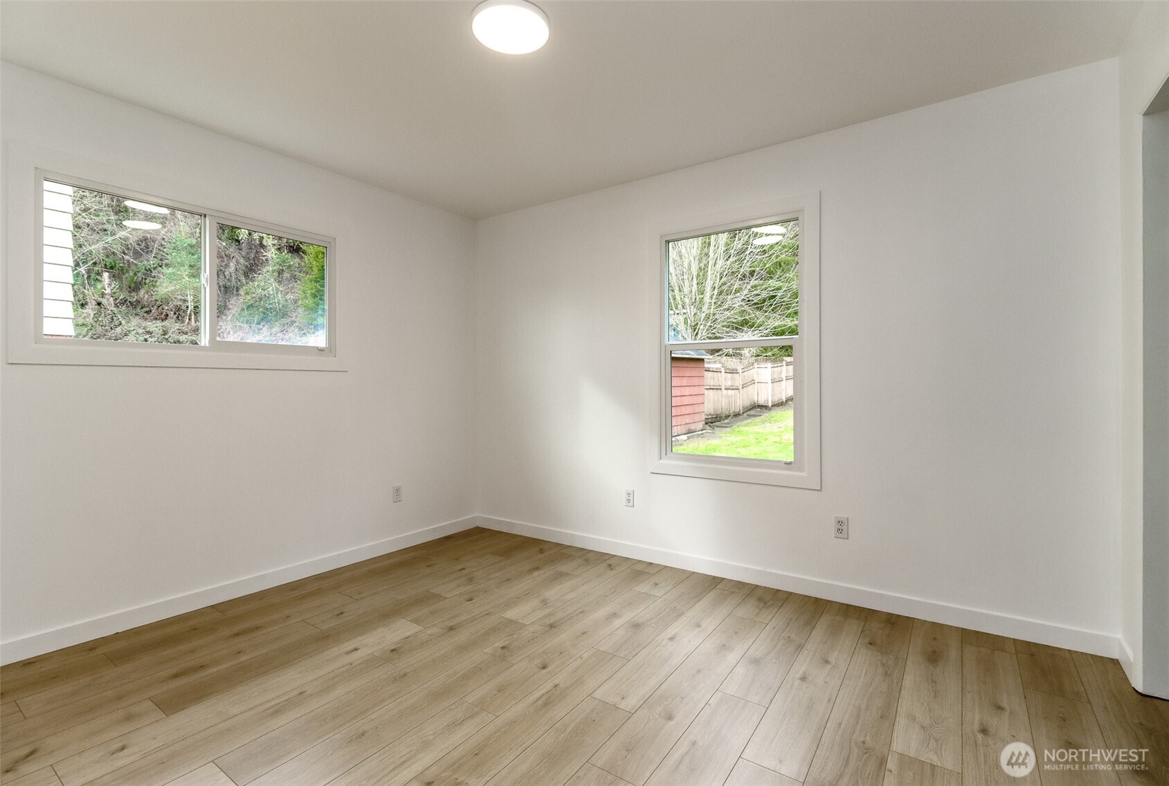 2115 Cherry Street Hoquiam, WA 98550 - Photo 12 of 31 a view of empty room with window and wooden floor
