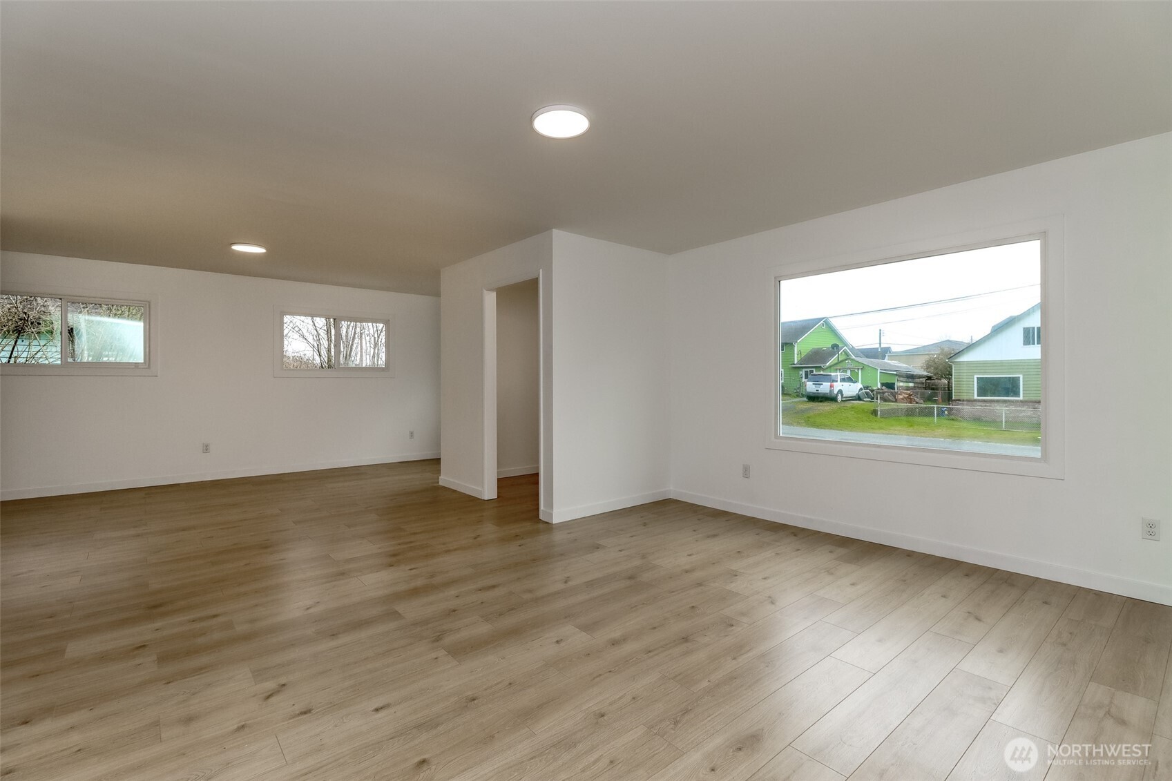 2115 Cherry Street Hoquiam, WA 98550 - Photo 16 of 31 an empty room with wooden floor and windows