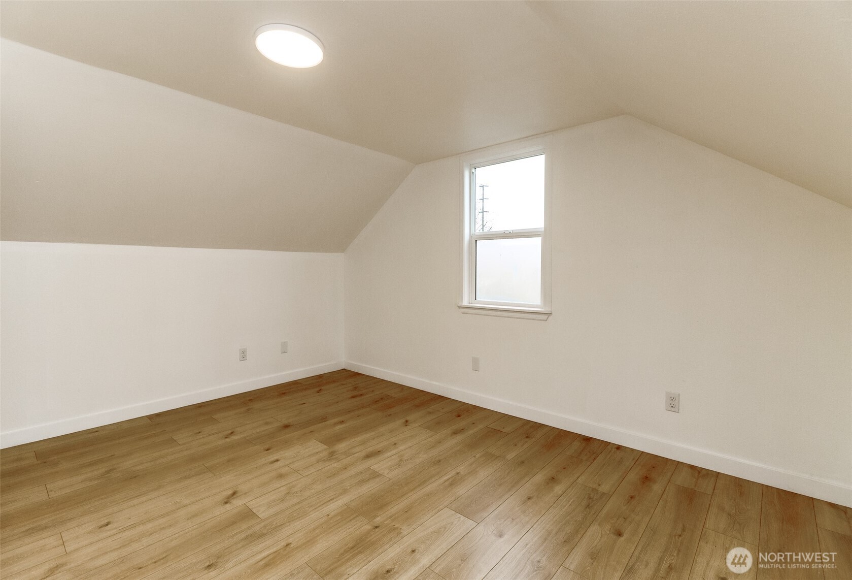 2115 Cherry Street Hoquiam, WA 98550 - Photo 17 of 31 an empty room with wooden floor and windows