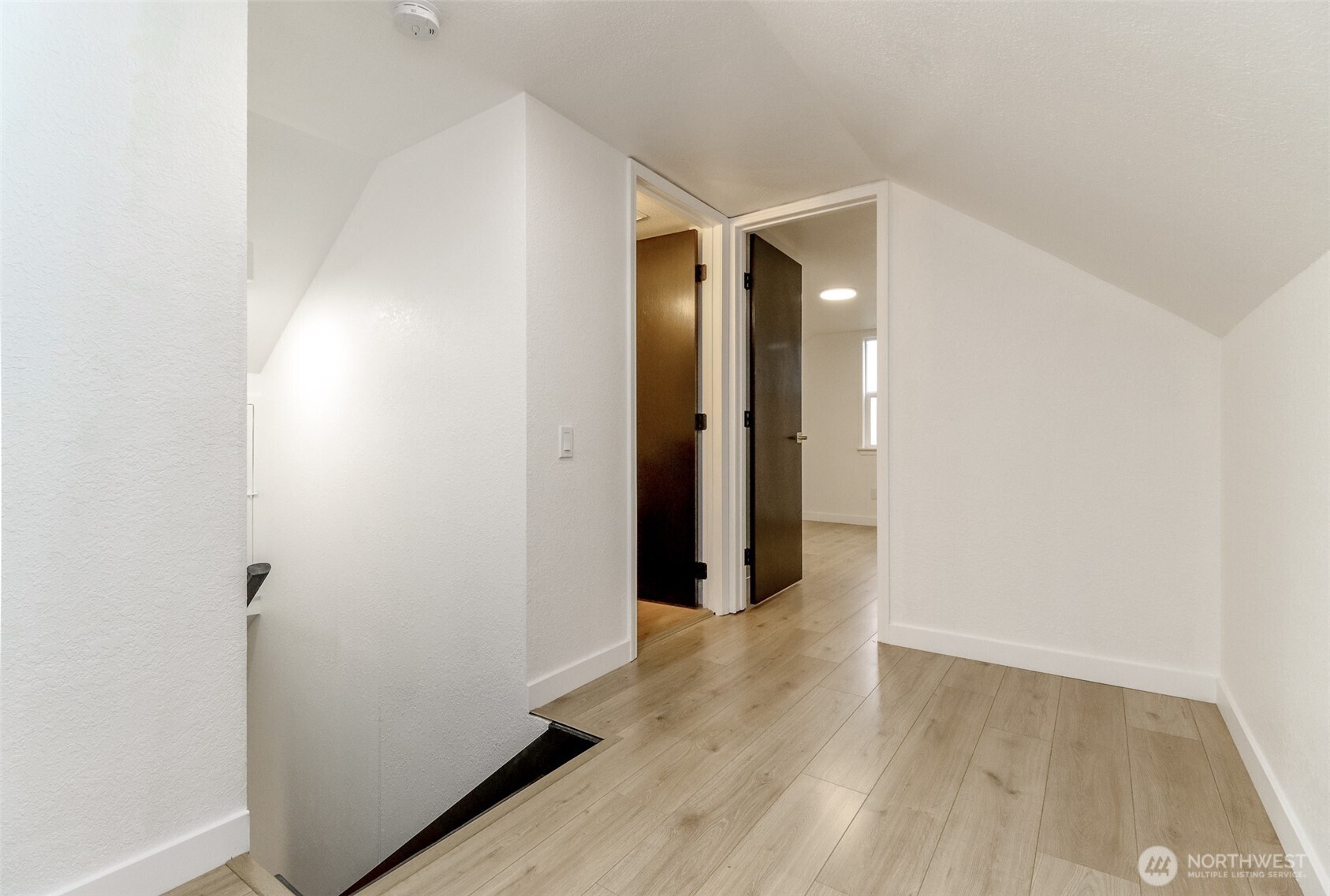 2115 Cherry Street Hoquiam, WA 98550 - Photo 19 of 31 a view of a hallway with wooden floor