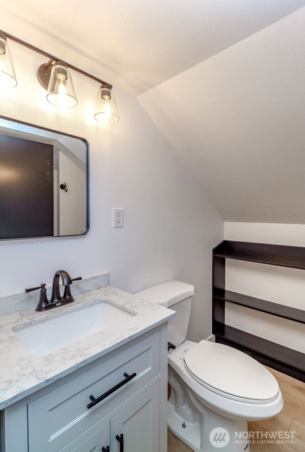 2115 Cherry Street Hoquiam, WA 98550 - Photo 21 of 31 a bathroom with a toilet a sink and mirror