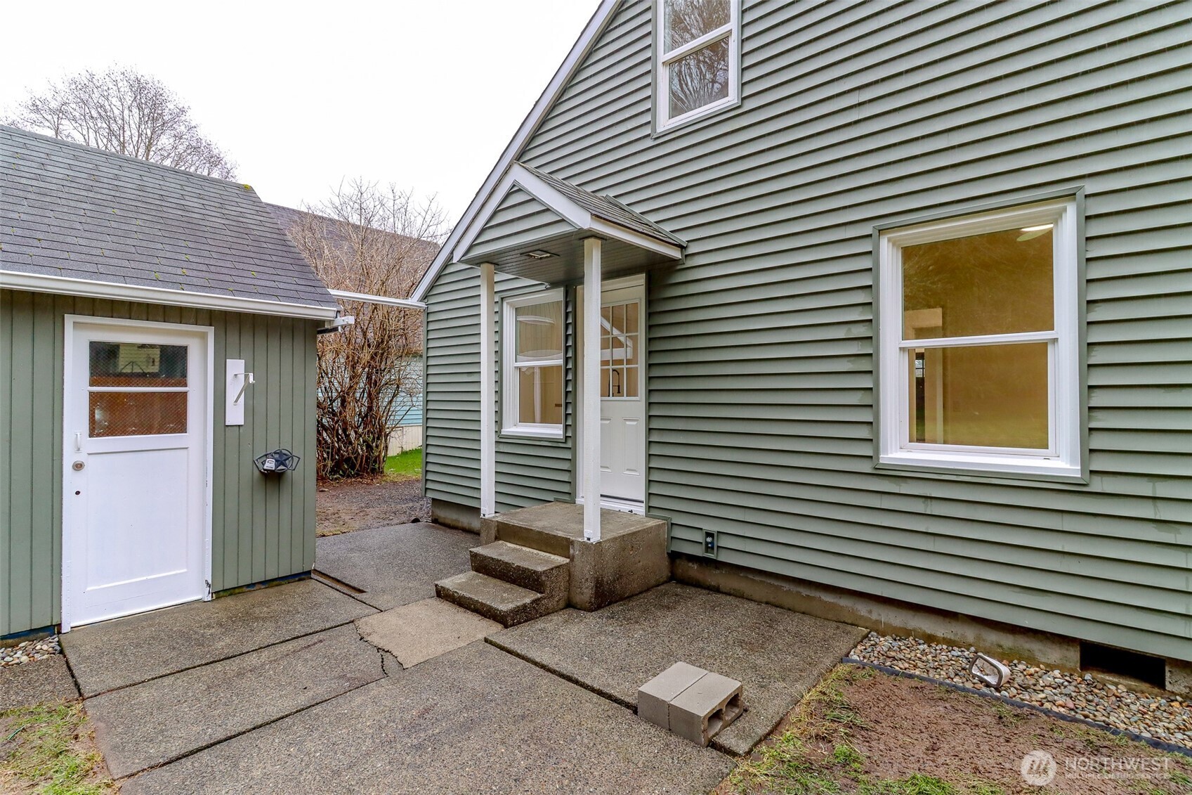 2115 Cherry Street Hoquiam, WA 98550 - Photo 25 of 31 a view of a house with a door and a yard