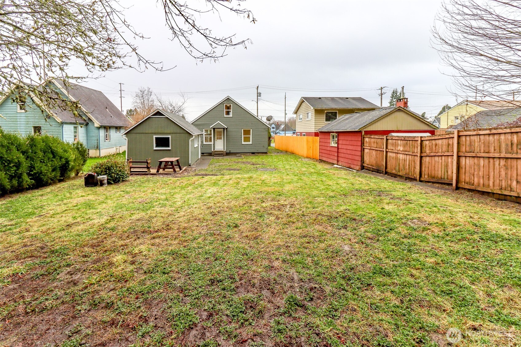 2115 Cherry Street Hoquiam, WA 98550 - Photo 29 of 31 a front view of a house with a yard and garage