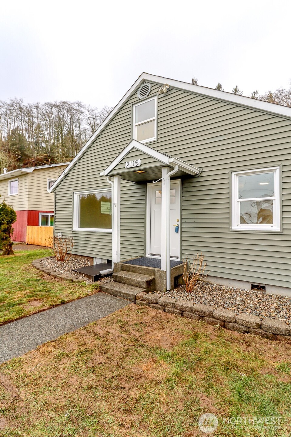 2115 Cherry Street Hoquiam, WA 98550 - Photo 3 of 31 a front view of a house with a yard