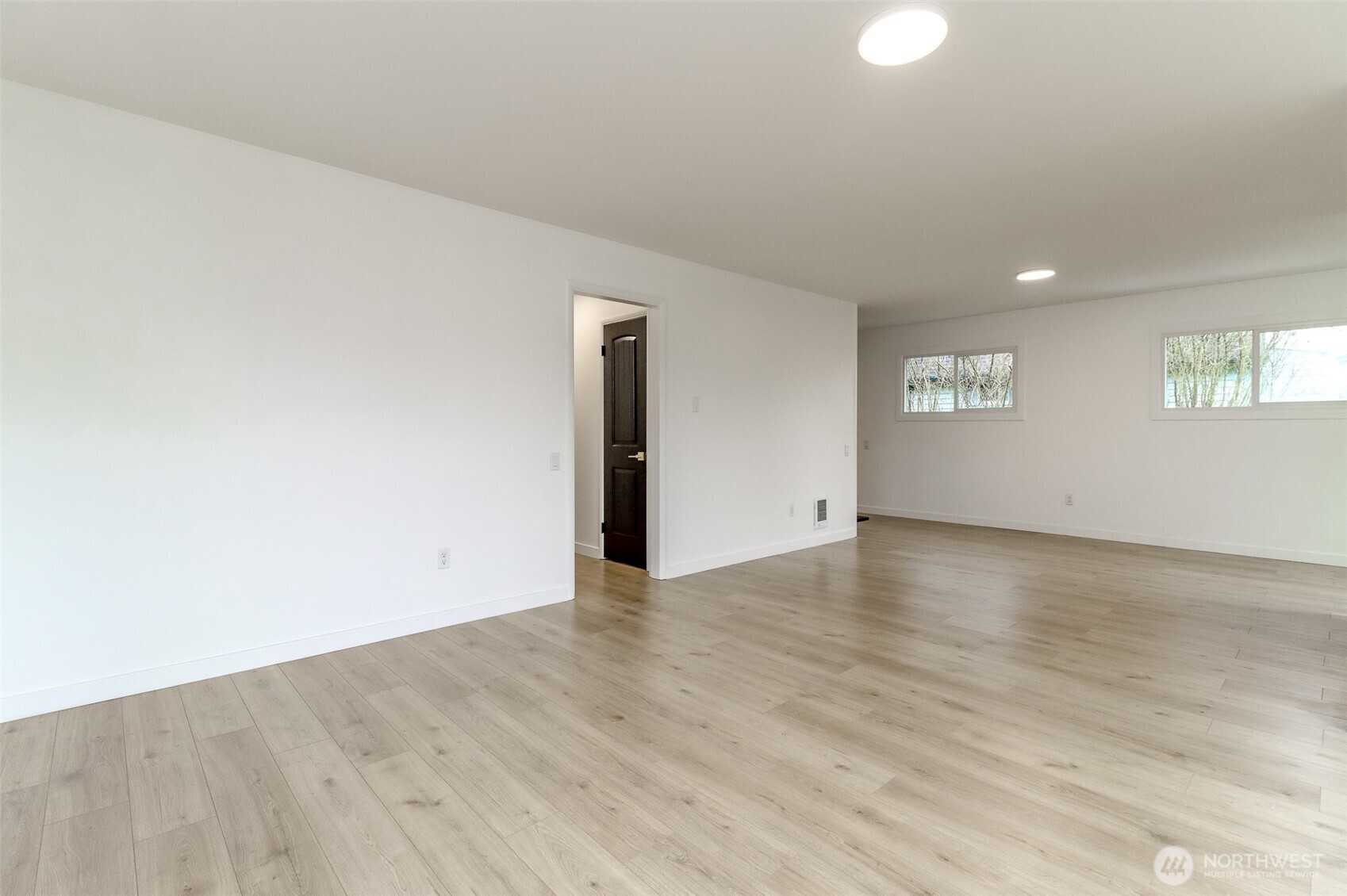 2115 Cherry Street Hoquiam, WA 98550 - Photo 6 of 31 an empty room with wooden floor and windows