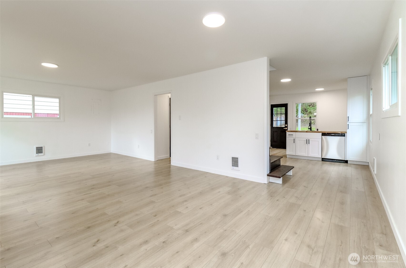 2115 Cherry Street Hoquiam, WA 98550 - Photo 8 of 31 an empty room with wooden floor and windows