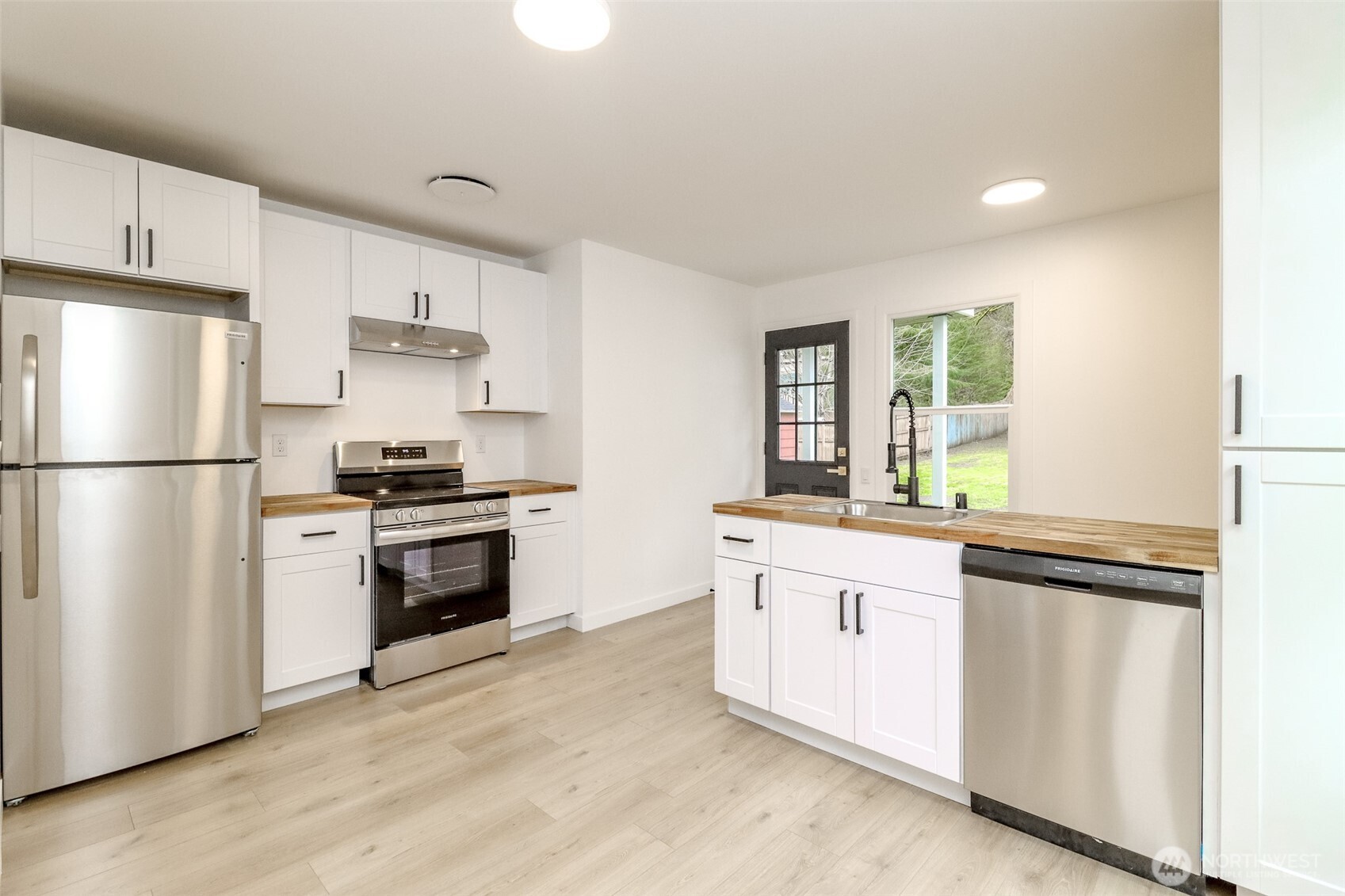 2115 Cherry Street Hoquiam, WA 98550 - Photo 9 of 31 a kitchen with stainless steel appliances a refrigerator sink and stove