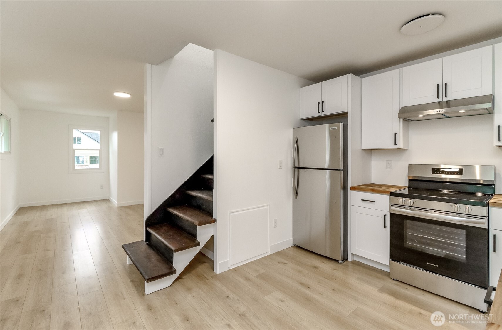 2115 Cherry Street Hoquiam, WA 98550 - Photo 10 of 31 a kitchen with stainless steel appliances granite countertop a stove a refrigerator and a microwave