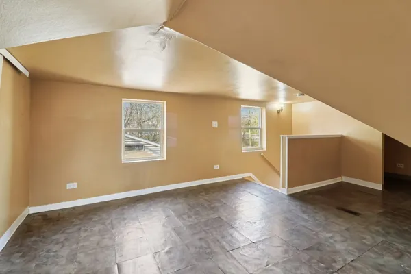 a view of an empty room with windows