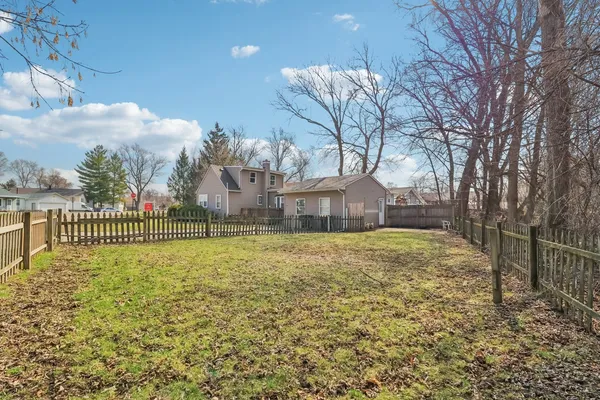 a view of a yard with a house