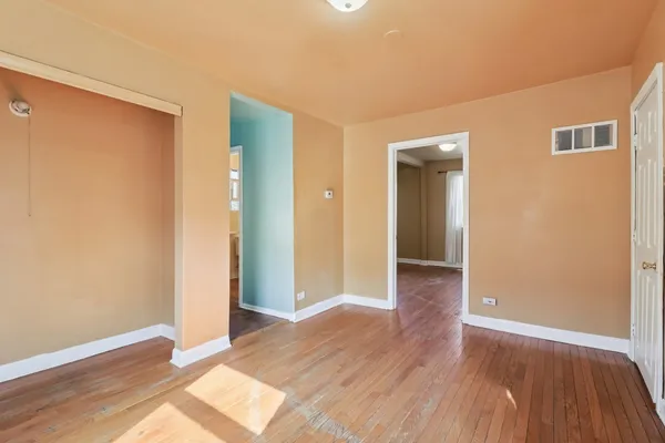 a view of a livingroom with wooden floor