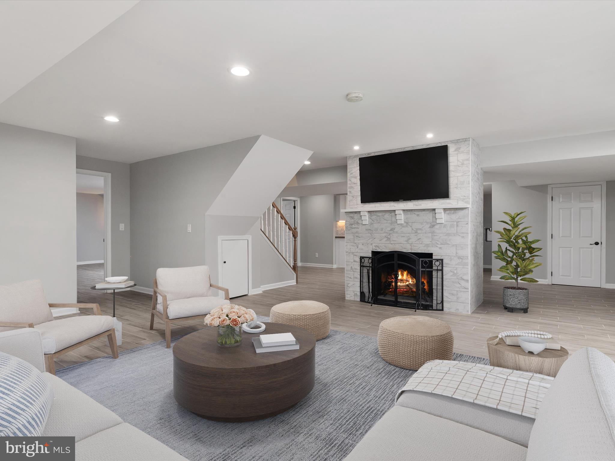 9510 Ardwick Ardmore Road Bowie, MD 20721 - Photo 47 of 60 Lower level living area with fireplace