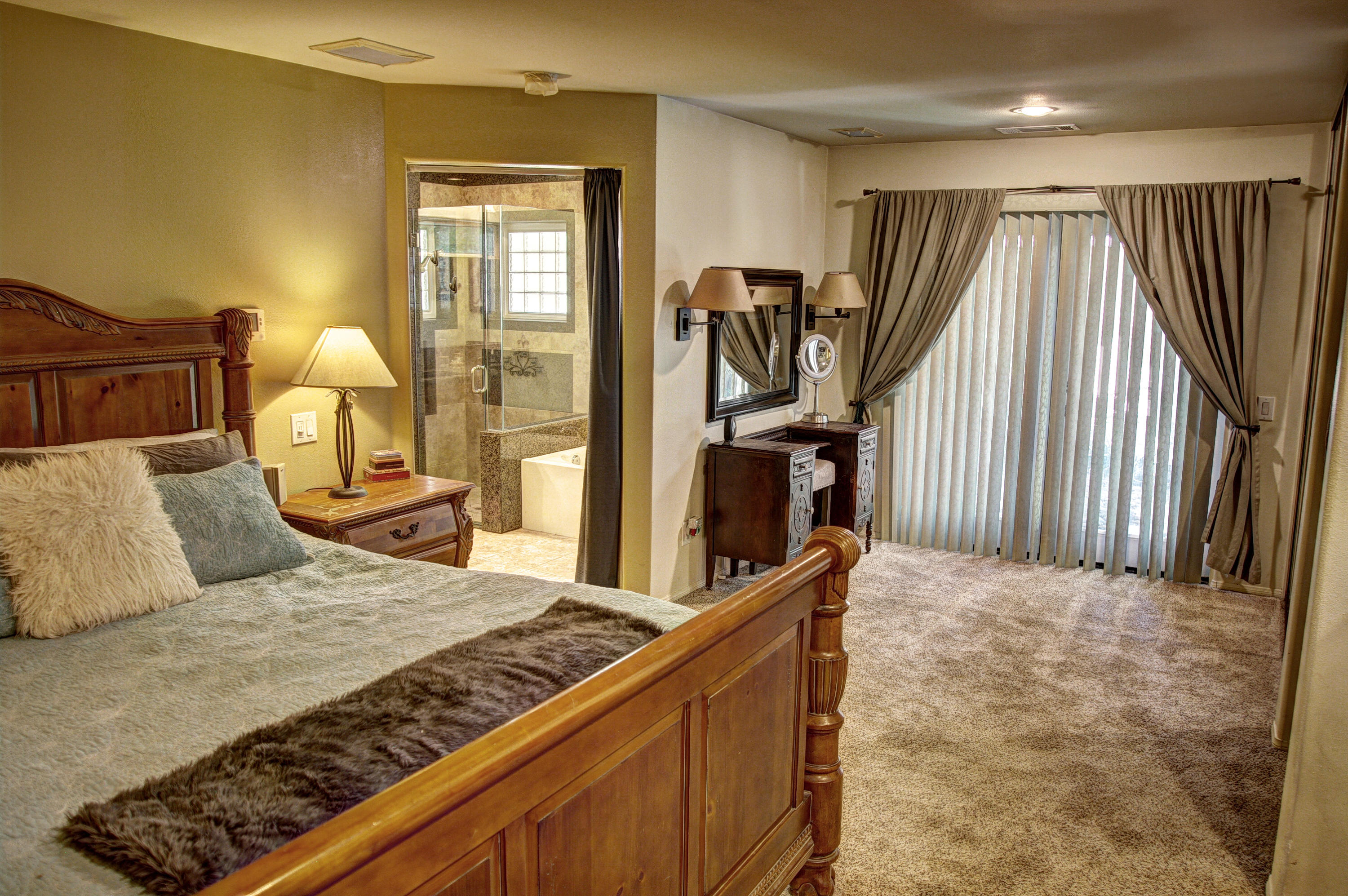 68446 Terrace Road Cathedral City, CA 92234 - Photo 40 of 81 a bedroom with a bed and a flat tv screen on dresser