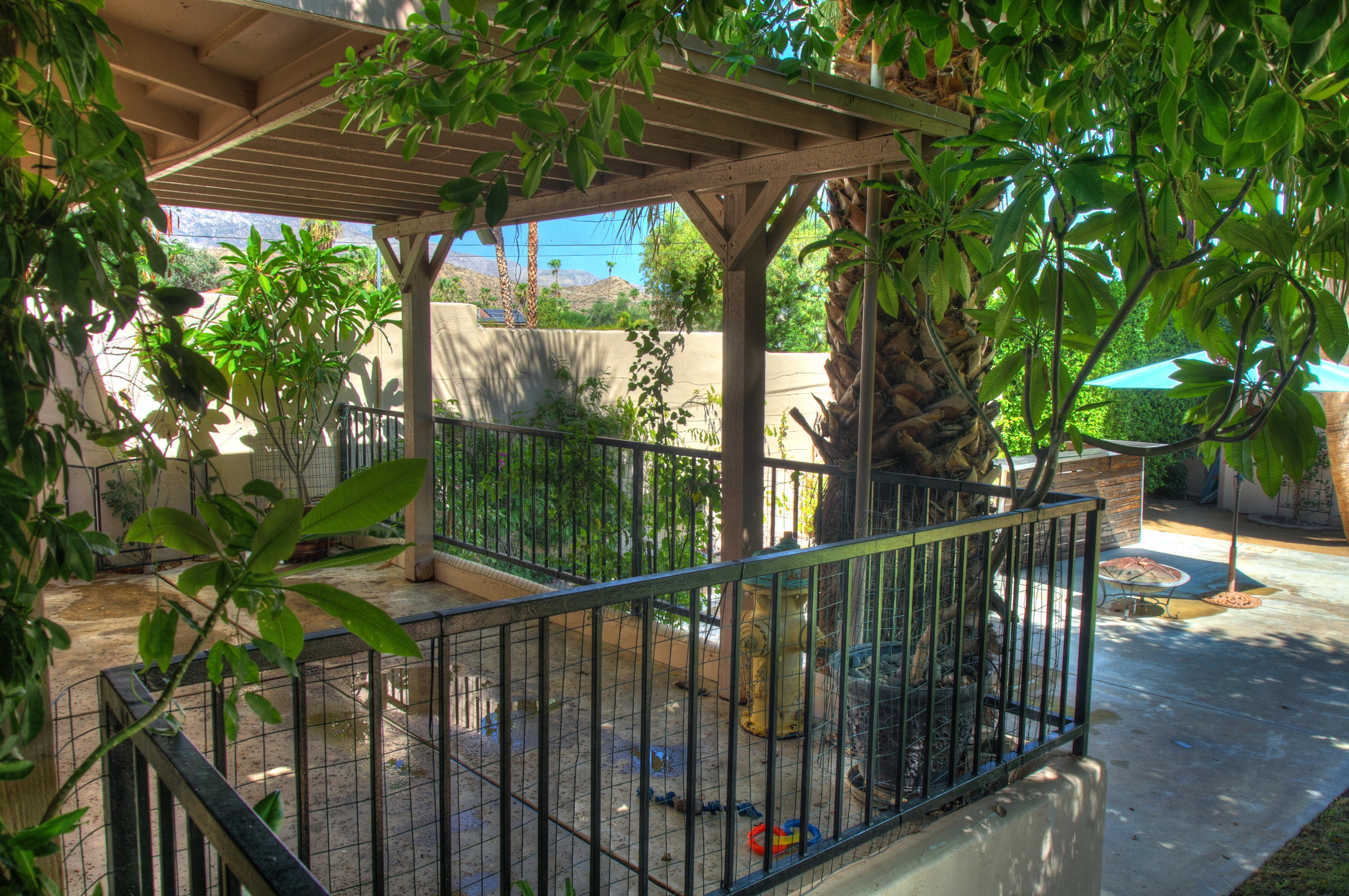 68446 Terrace Road Cathedral City, CA 92234 - Photo 54 of 81 a view of a patio with table and chairs under an umbrella