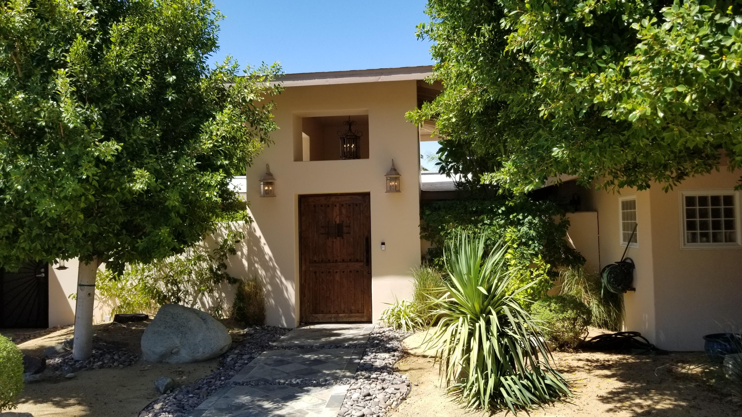 68446 Terrace Road Cathedral City, CA 92234 - Photo 7 of 81 a front view of a house with a yard