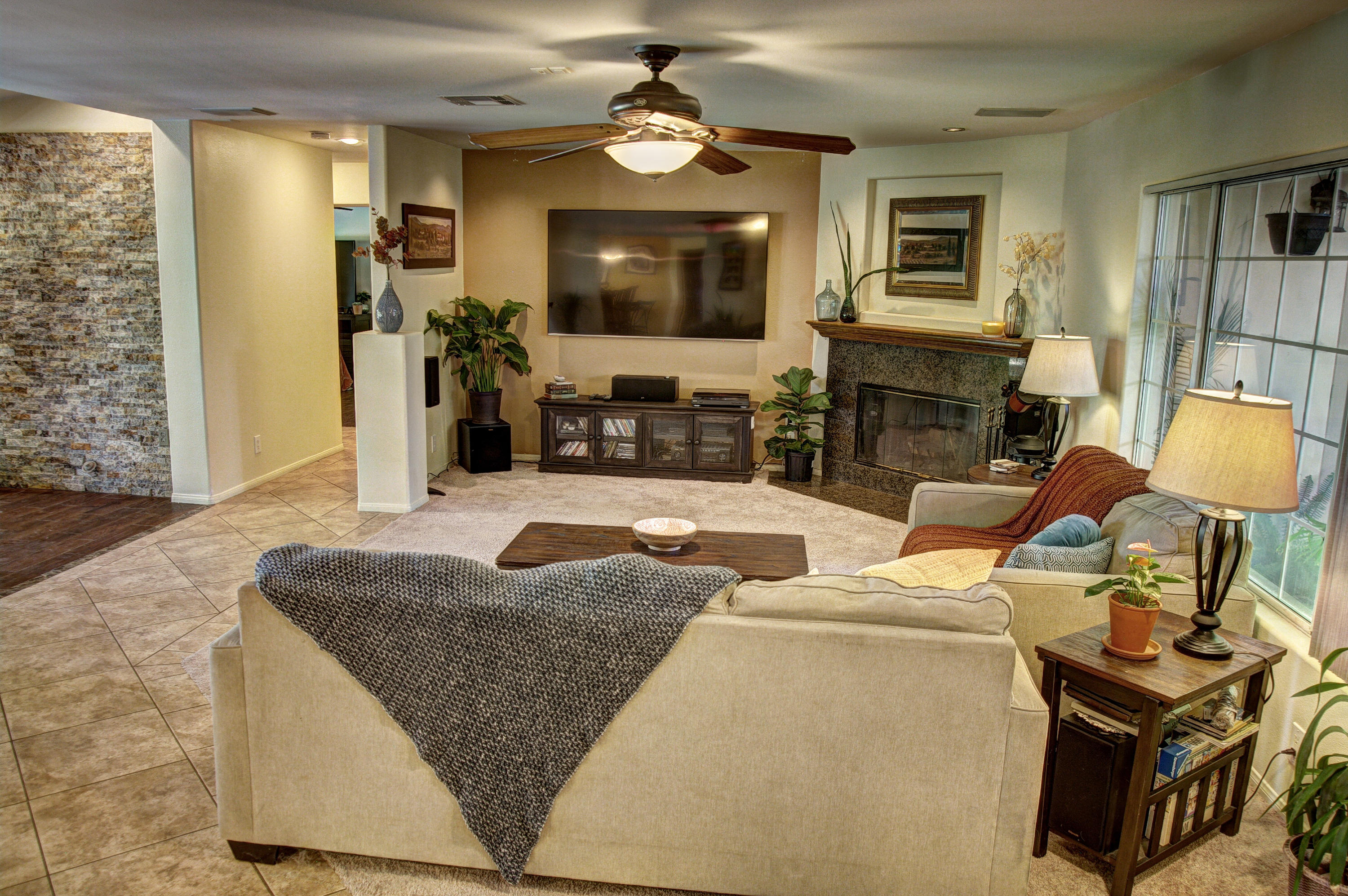 68446 Terrace Road Cathedral City, CA 92234 - Photo 8 of 81 a living room with furniture a fireplace and a flat screen tv