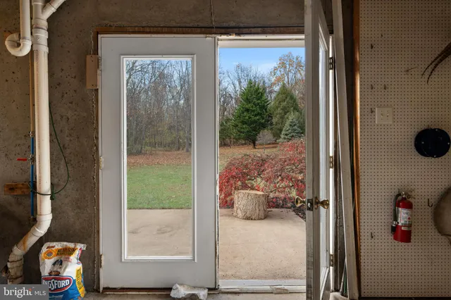 a view of a door and chair in the balcony