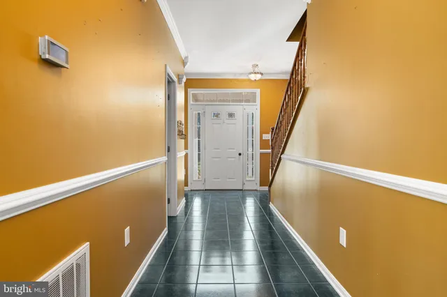a living room with a fireplace with wooden floor