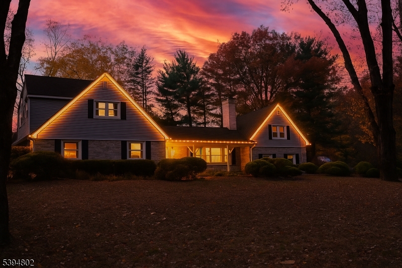 209 Lake Road Bernards, NJ 07920 - Photo 4 of 40 a front view of a house with a yard and garage