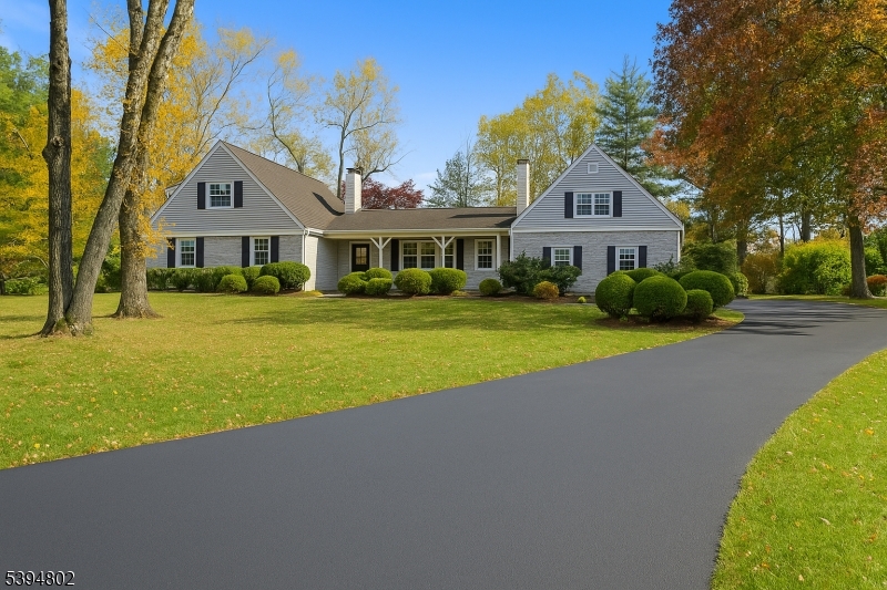 209 Lake Road Bernards, NJ 07920 - Photo 5 of 40 a front view of a house with a yard and trees