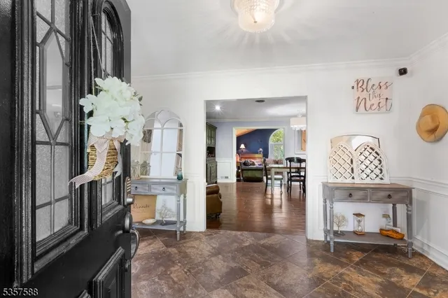 a kitchen with stainless steel appliances granite countertop a stove a sink a refrigerator and a microwave