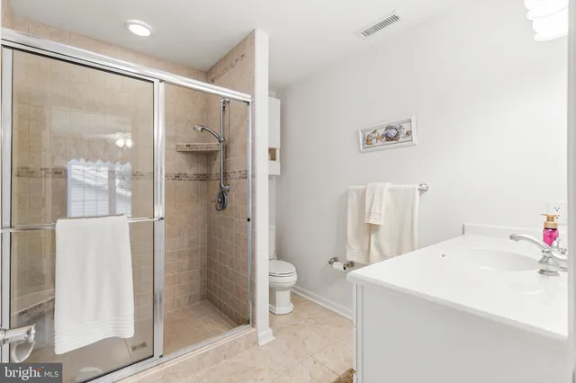 a bathroom with a sink and a large mirror