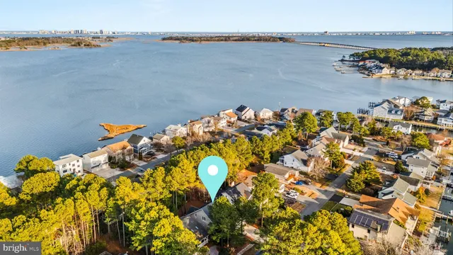 an aerial view of a house with a lake view