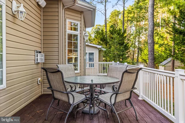 a view of a chairs on wooden deck