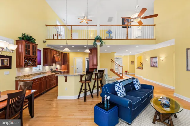 a living room with furniture a rug and white walls