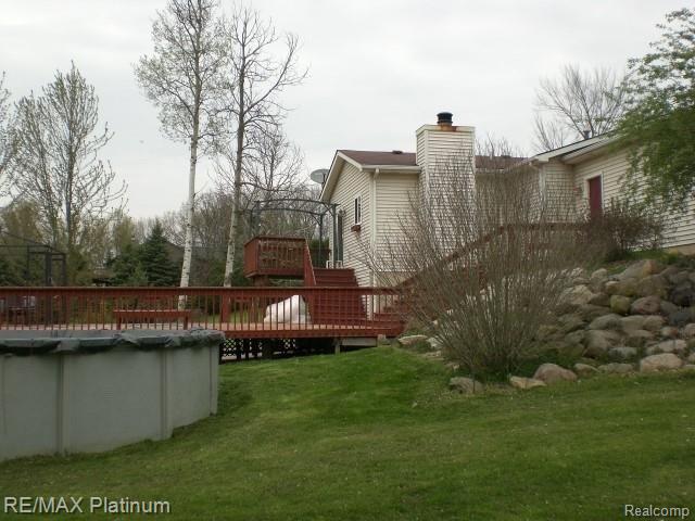 4052 Cedar Lake Road Howell, MI 48843 - Photo 25 of 34 Rear of home/deck/pool