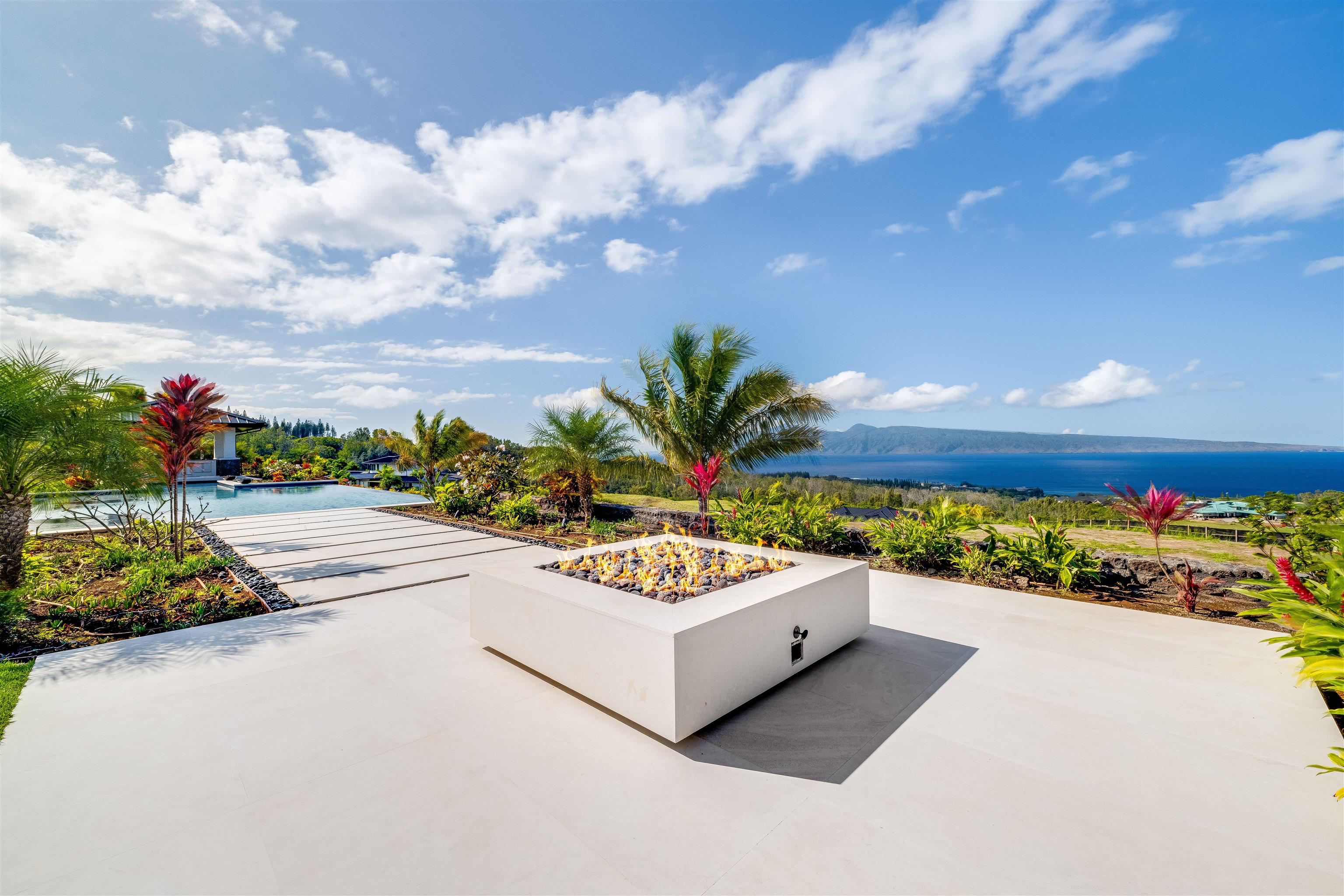 710 Mahana Rdg Street, Unit LOT 46 Lahaina, HI 96761 - Photo 17 of 50 a view of a bench in front of a house