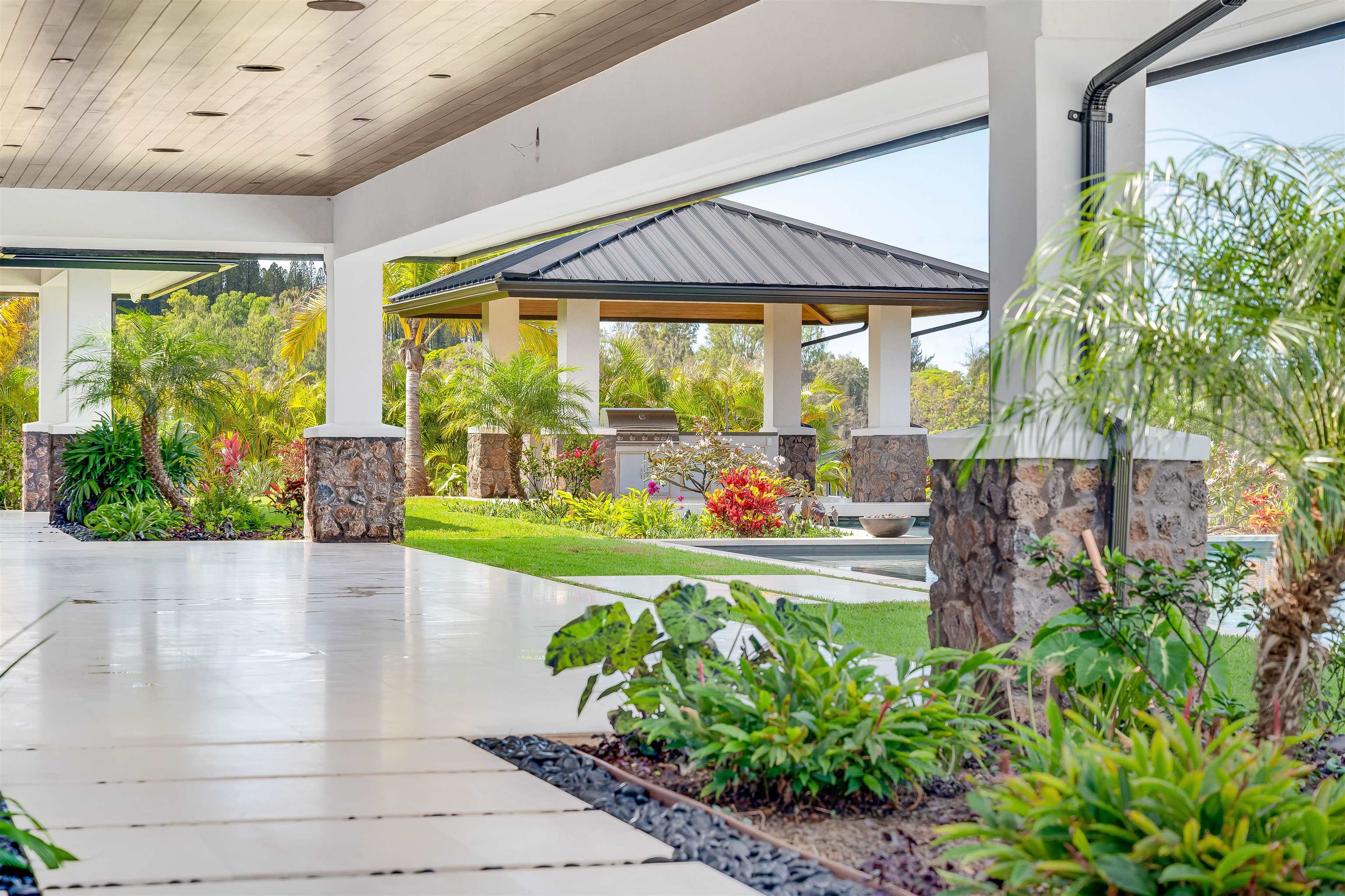 710 Mahana Rdg Street, Unit LOT 46 Lahaina, HI 96761 - Photo 26 of 50 a front view of a house with garden