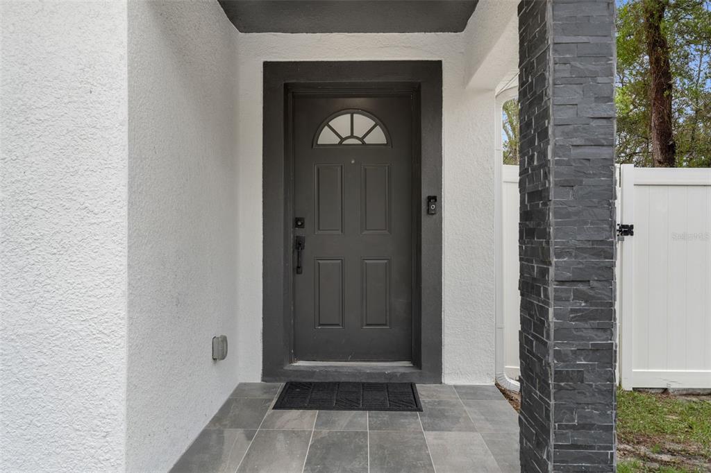 5106 Pacific Avenue Spring Hill, FL 34606 - Photo 2 of 23 a view of an entryway of a house