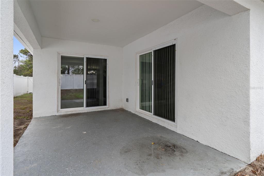 5106 Pacific Avenue Spring Hill, FL 34606 - Photo 21 of 23 an empty room with windows