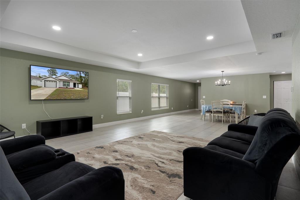 5106 Pacific Avenue Spring Hill, FL 34606 - Photo 7 of 23 a living room with furniture and a couch