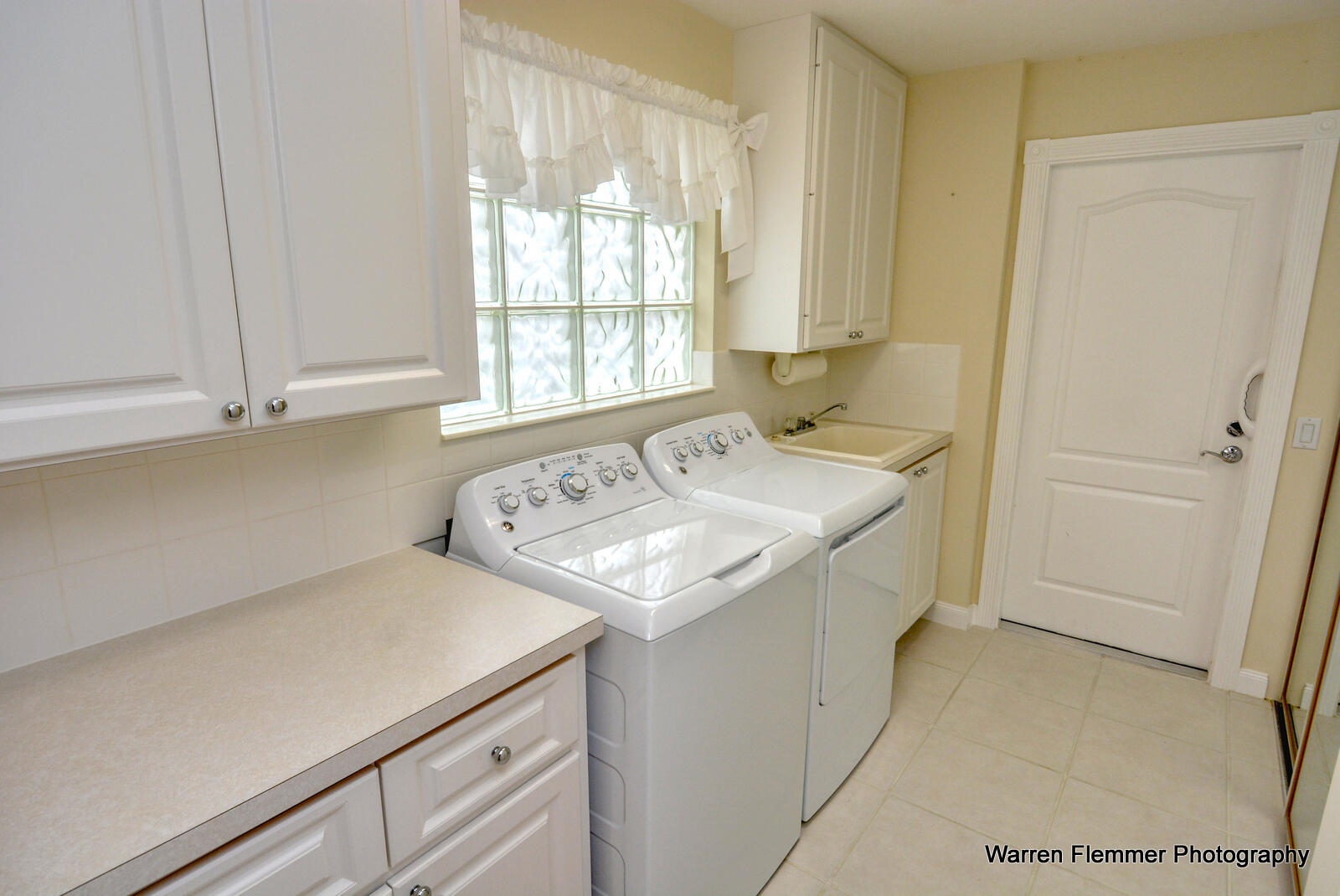 1044 Southwest Balmoral Trace Stuart, FL 34997 - Photo 12 of 34 a utility room with washer and dryer