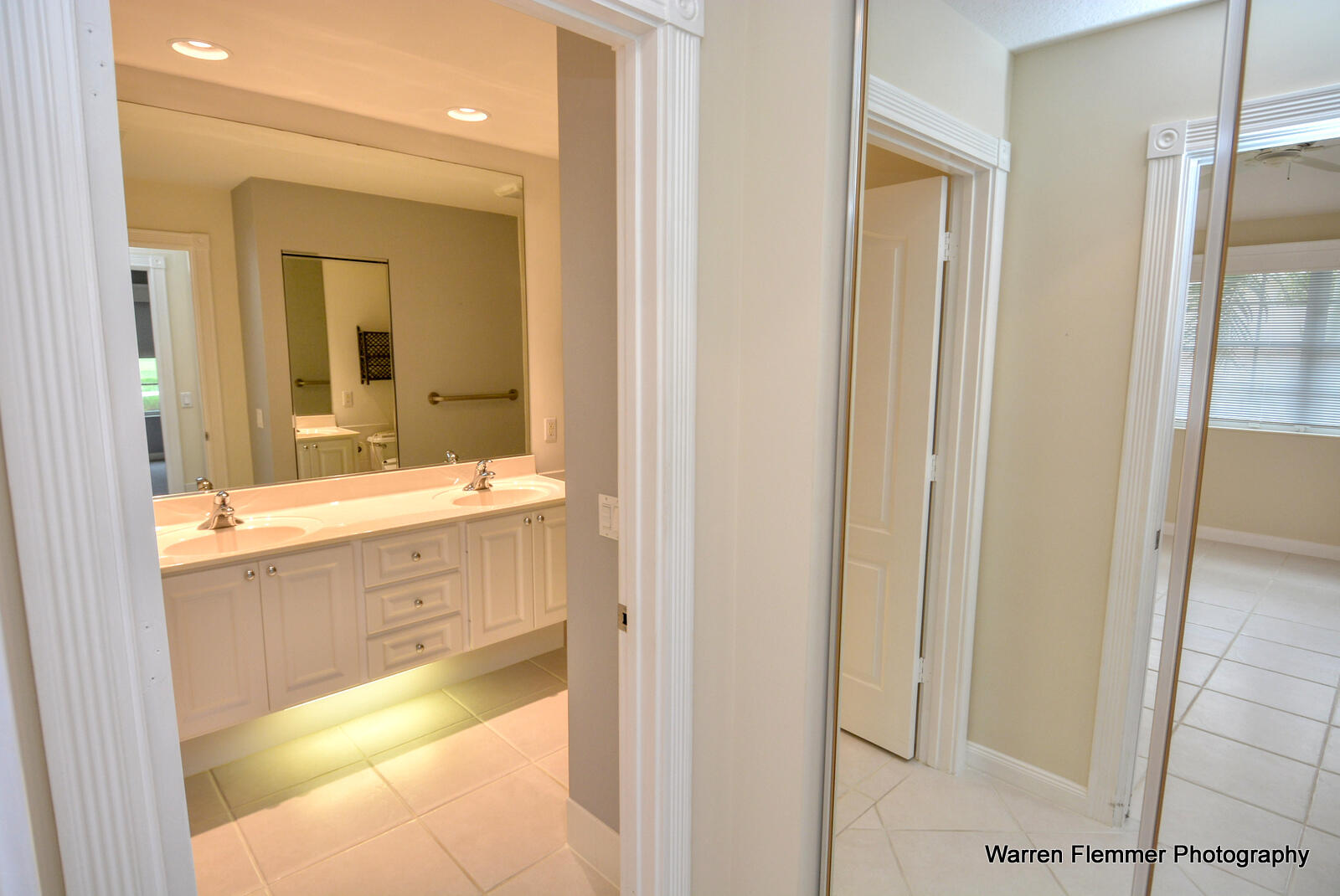 1044 Southwest Balmoral Trace Stuart, FL 34997 - Photo 15 of 34 a bathroom with a sink and a mirror