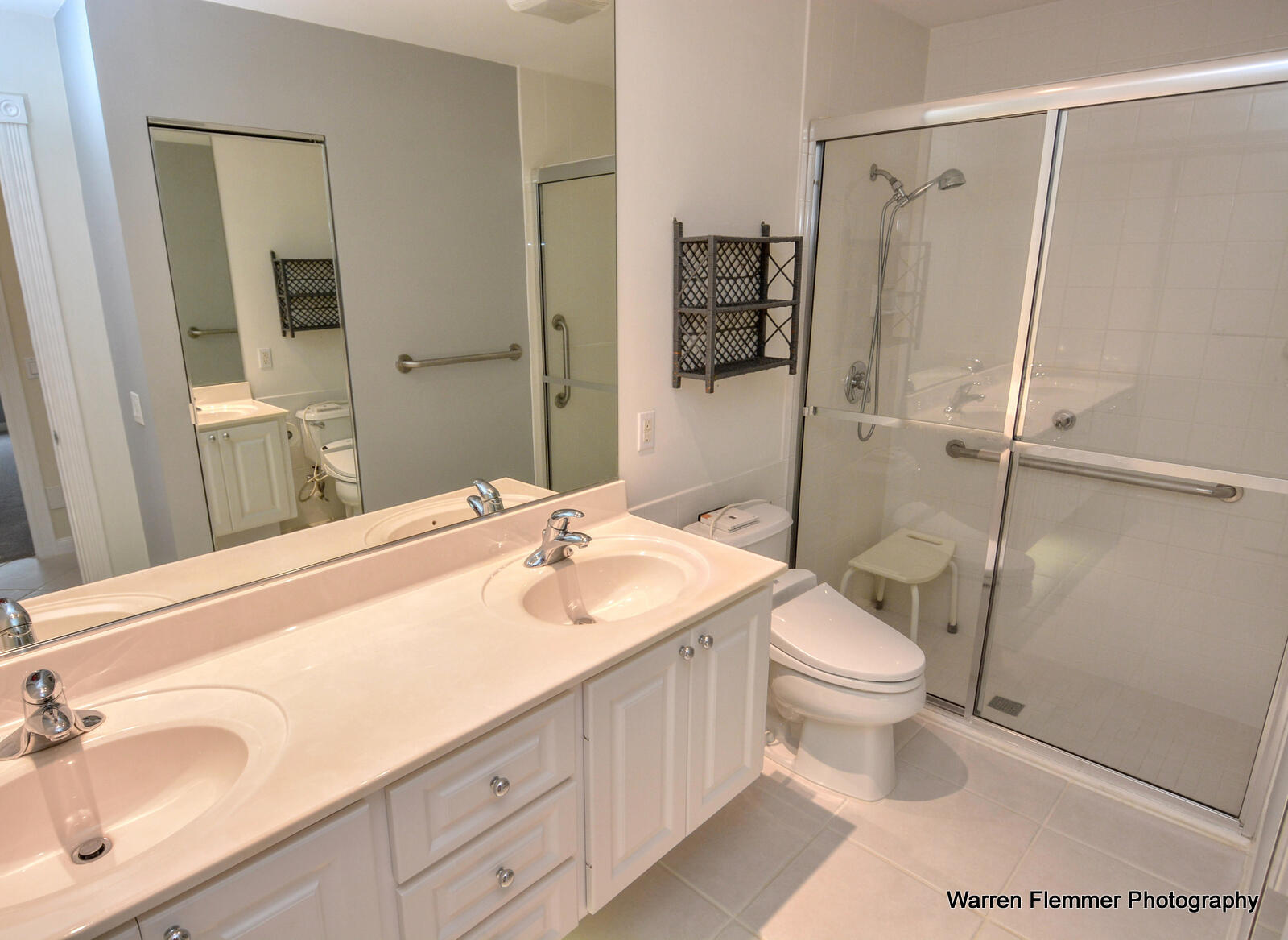 1044 Southwest Balmoral Trace Stuart, FL 34997 - Photo 16 of 34 a bathroom with a sink toilet and shower