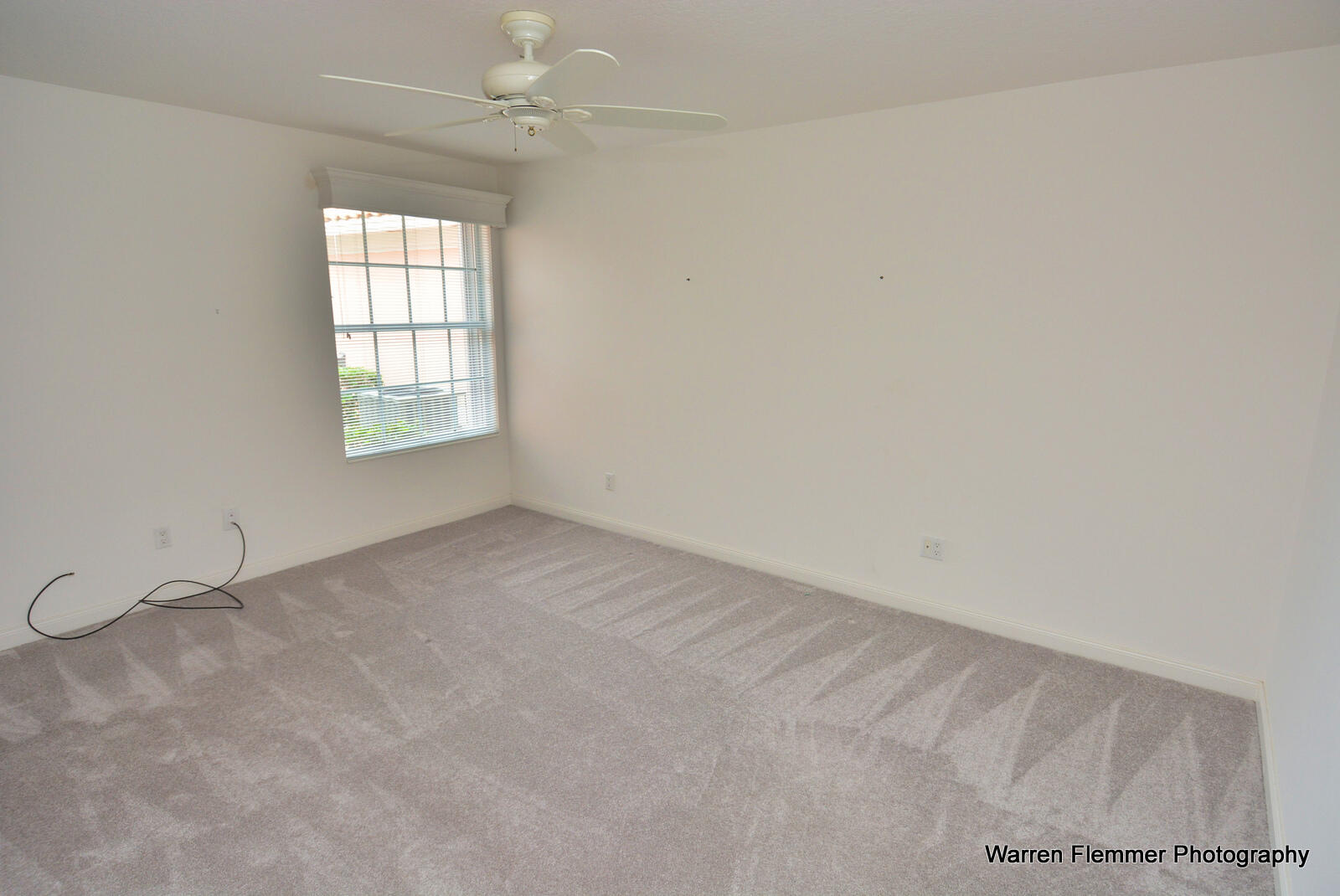 1044 Southwest Balmoral Trace Stuart, FL 34997 - Photo 18 of 34 an empty room with windows and closet