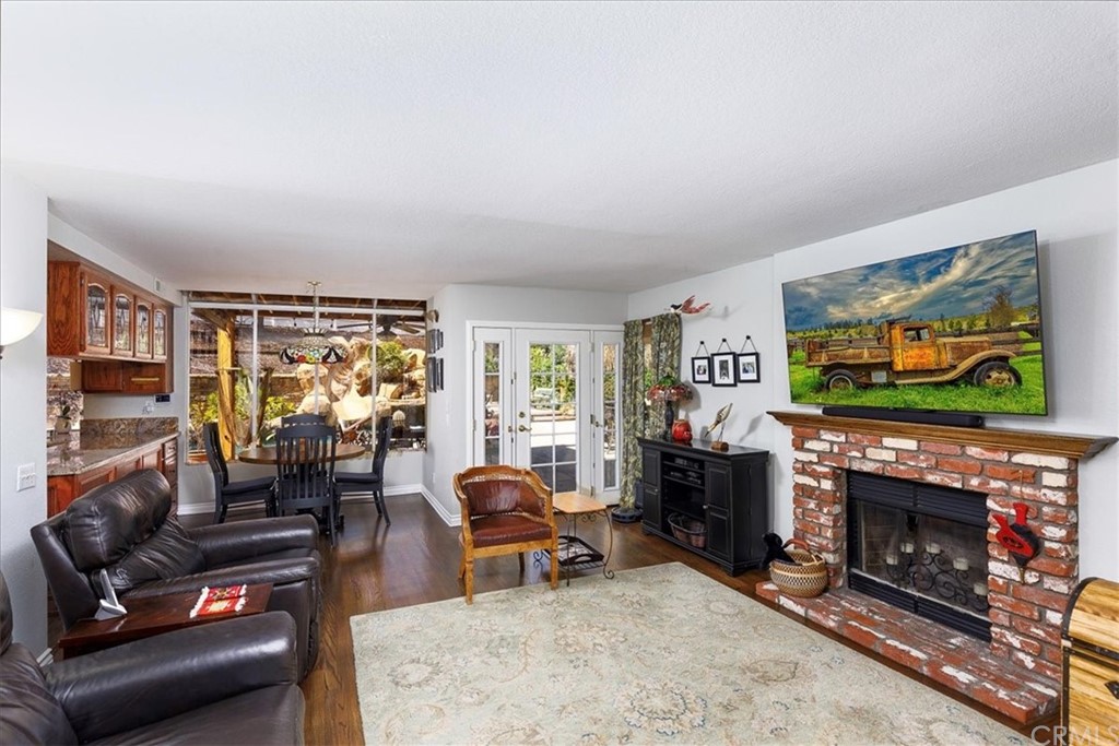 30152 Corte Carrizo Temecula, CA 92591 - Photo 12 of 45 a living room with furniture a flat screen tv and a fireplace