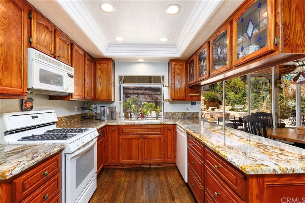 30152 Corte Carrizo Temecula, CA 92591 - Photo 14 of 45 a kitchen with stainless steel appliances granite countertop a stove and cabinets