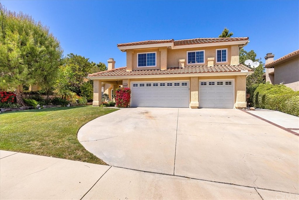 30152 Corte Carrizo Temecula, CA 92591 - Photo 2 of 45 a view of a house with a small yard plants and a large tree