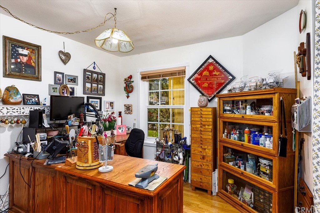 30152 Corte Carrizo Temecula, CA 92591 - Photo 24 of 45 a view of a workspace with furniture and a bookshelf