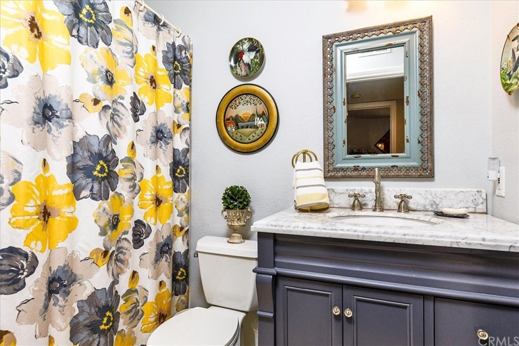30152 Corte Carrizo Temecula, CA 92591 - Photo 25 of 45 a bathroom with a sink and a mirror