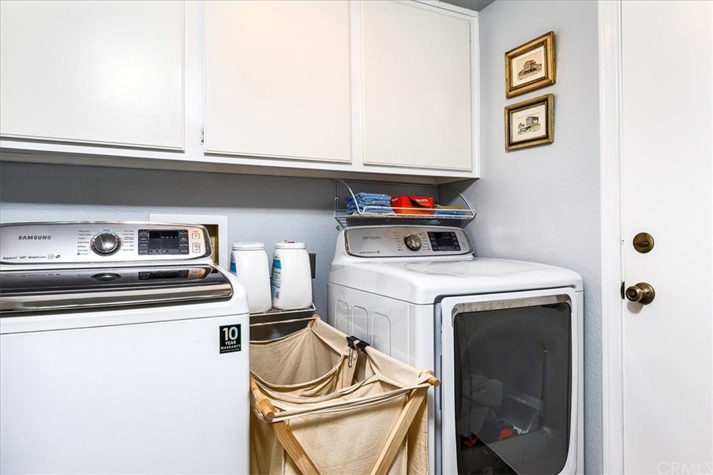 30152 Corte Carrizo Temecula, CA 92591 - Photo 26 of 45 a utility room with dryer and washer