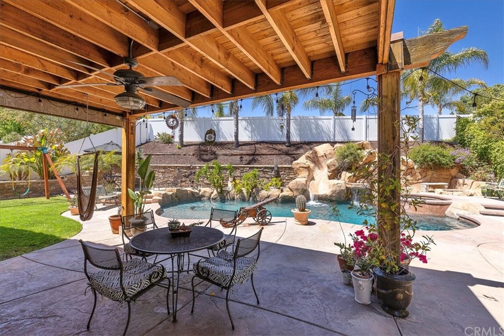 30152 Corte Carrizo Temecula, CA 92591 - Photo 30 of 45 a view of a patio with a table and chairs and a garden