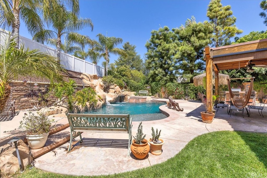 30152 Corte Carrizo Temecula, CA 92591 - Photo 37 of 45 a view of a patio with couches table and chairs and potted plants