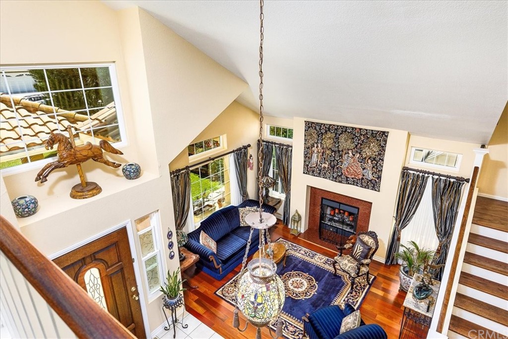30152 Corte Carrizo Temecula, CA 92591 - Photo 10 of 45 a living room with furniture and a fireplace
