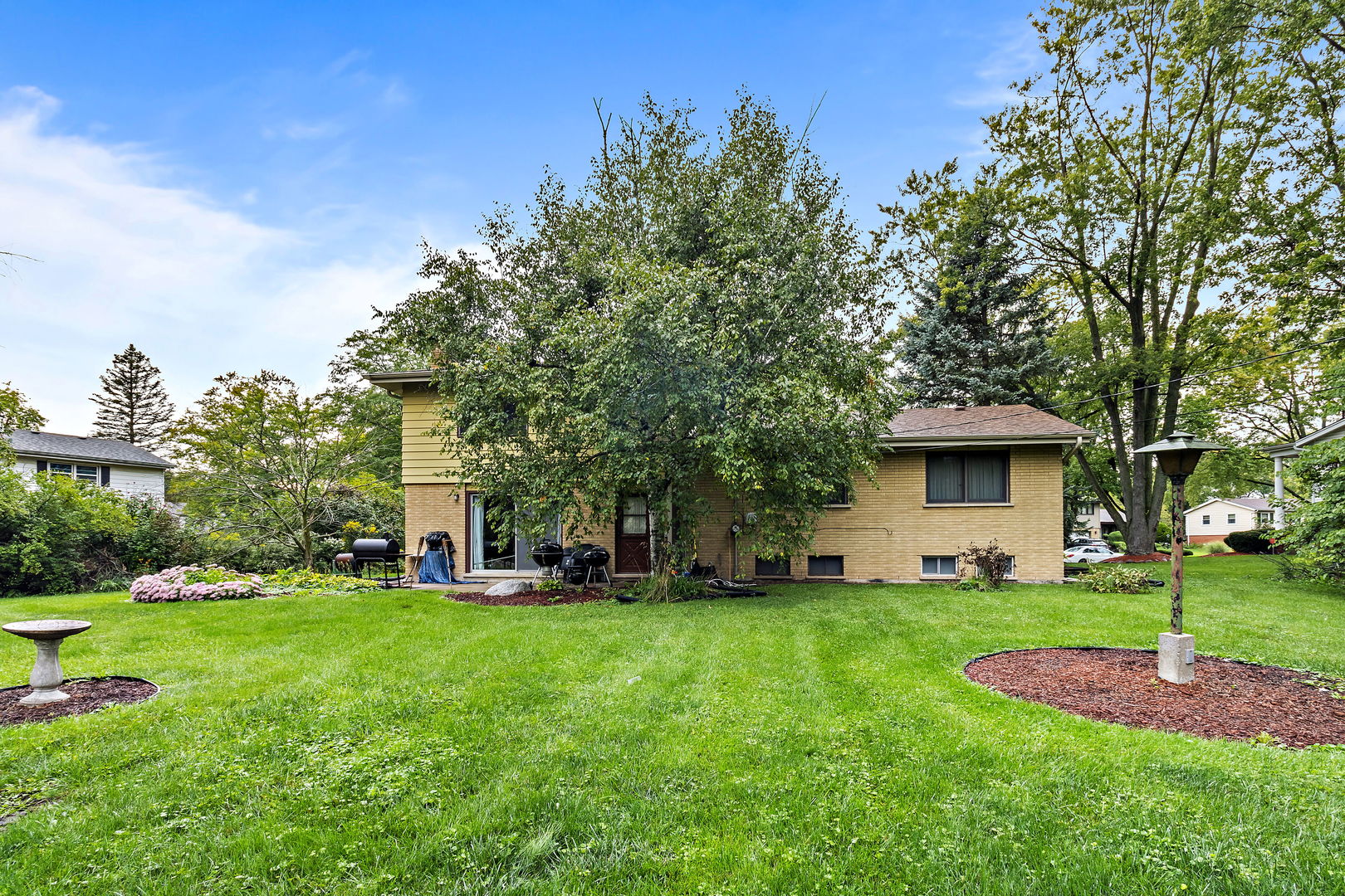 18807 Delta Road Homewood, IL 60430 - Photo 15 of 16 a view of a house with a big yard and large trees